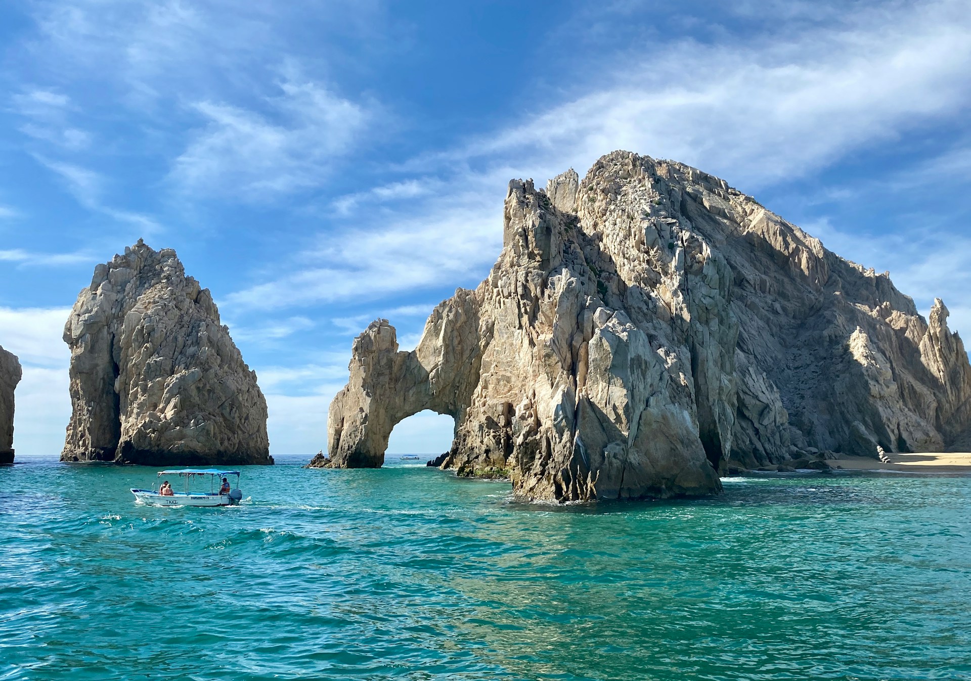 Dramatic desert cliffs meeting turquoise Pacific waters at the southern tip of Baja California Sur near Land's End